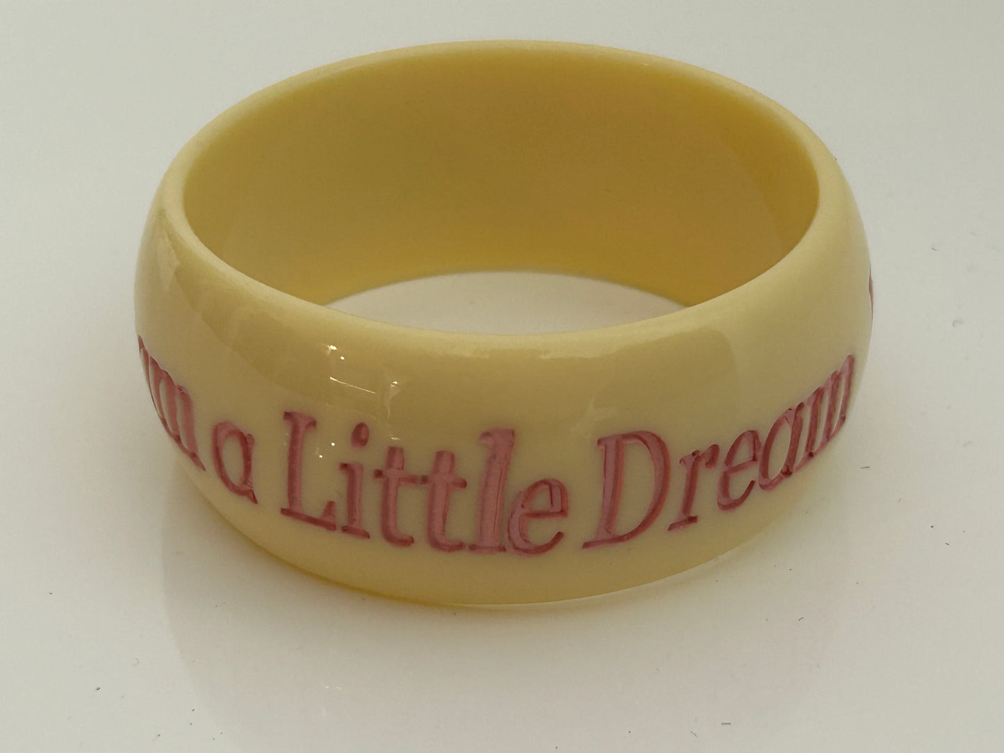 Vintage 1980s Chunky Cream & Pink "DREAM A LITTLE DREAM" Etched Bangle