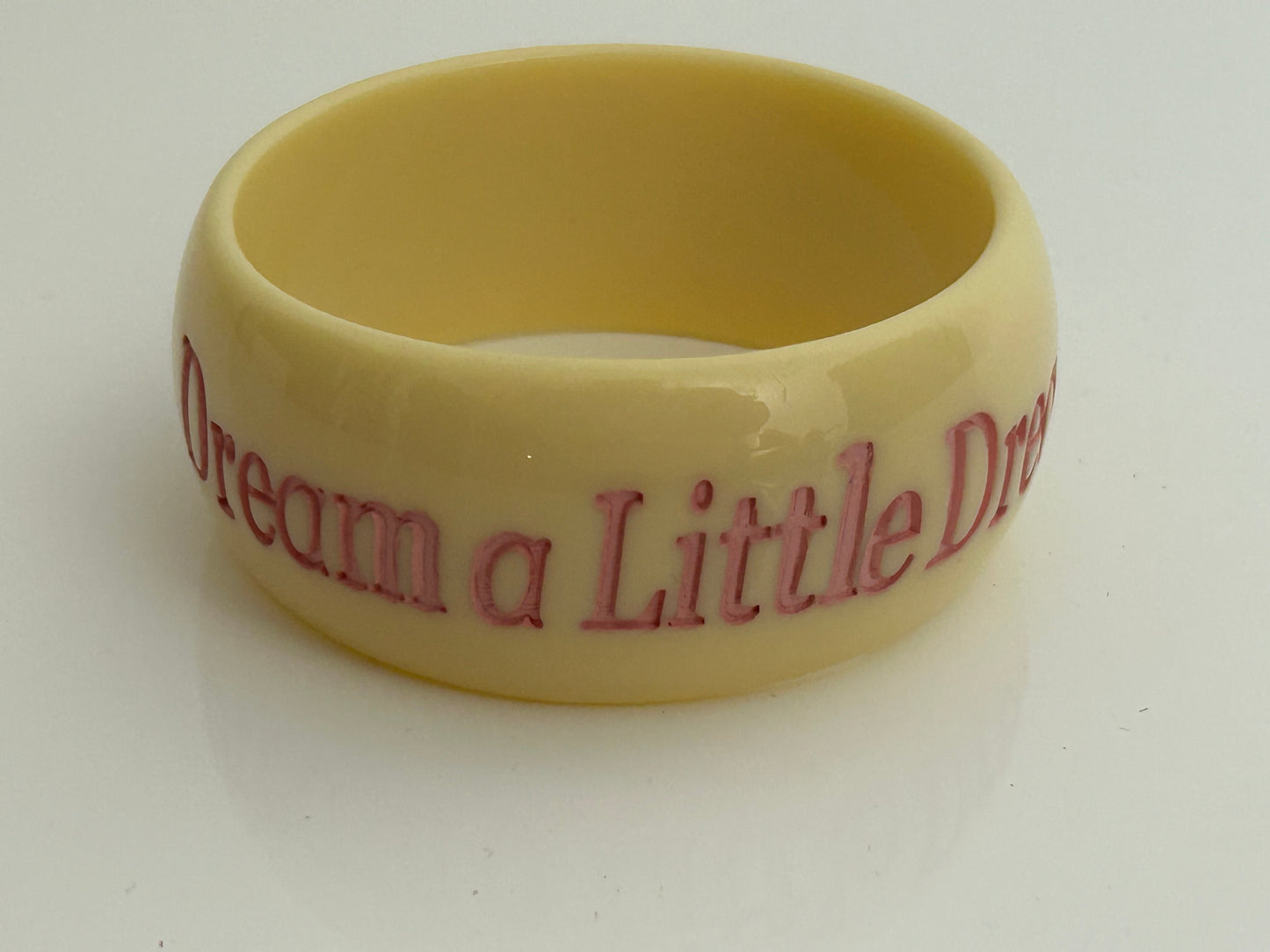 Vintage 1980s Chunky Cream & Pink "DREAM A LITTLE DREAM" Etched Bangle