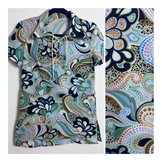 Vintage Early 1970s Size 10-12 White Navy Blue Green & Lilac Psychedelic Floral Print Lace Up Tie Neck Short Sleeve Top