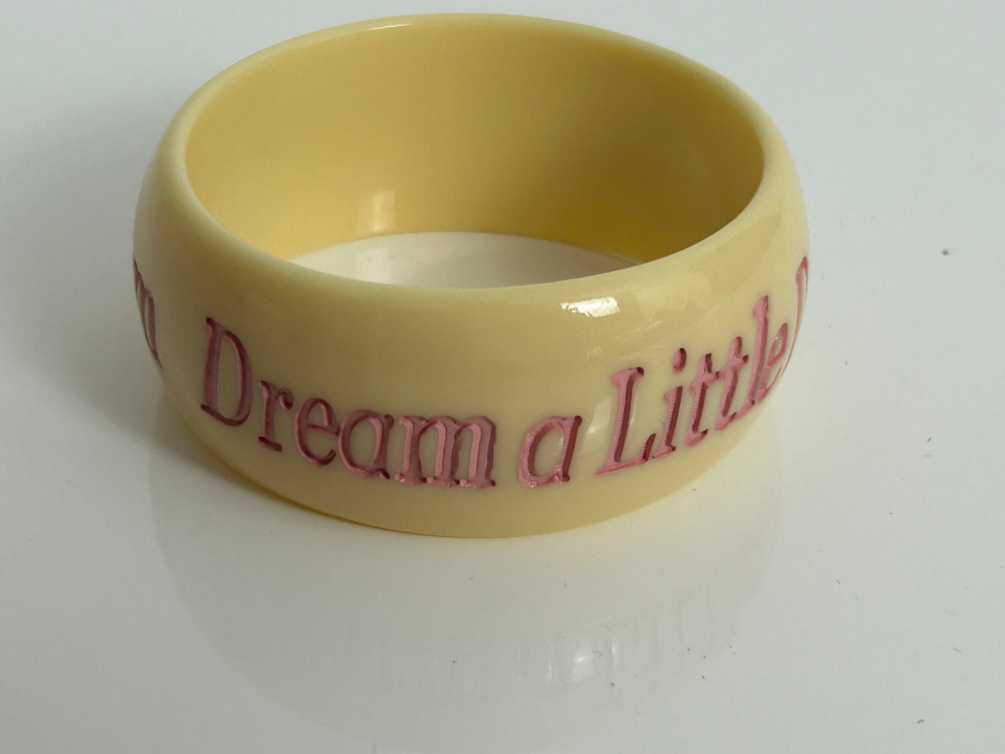 Vintage 1980s Chunky Cream & Pink "DREAM A LITTLE DREAM" Etched Bangle