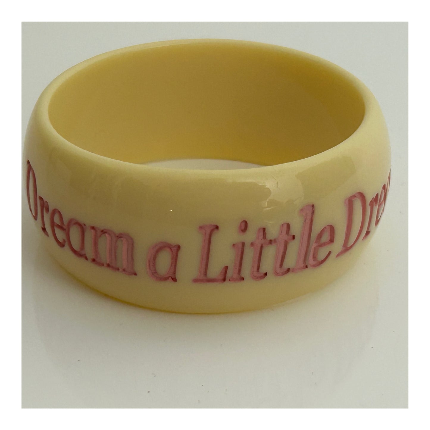 Vintage 1980s Chunky Cream & Pink "DREAM A LITTLE DREAM" Etched Bangle